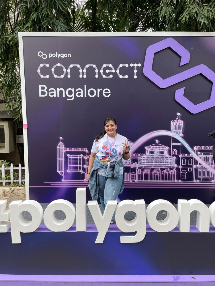 Ruhi in front of the Polygon Connect Bangalore backdrop